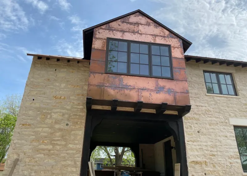 Copper metal panel facade on a stone building for Metal Roof Coating in Hamptonburgh